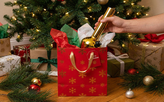 Red Christmas gift bag with festive decorations
