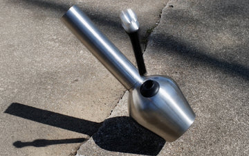 Stainless steel smoking device on pavement