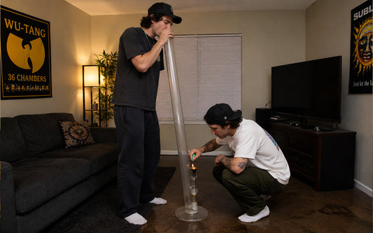 Friends using a bong in a living room
