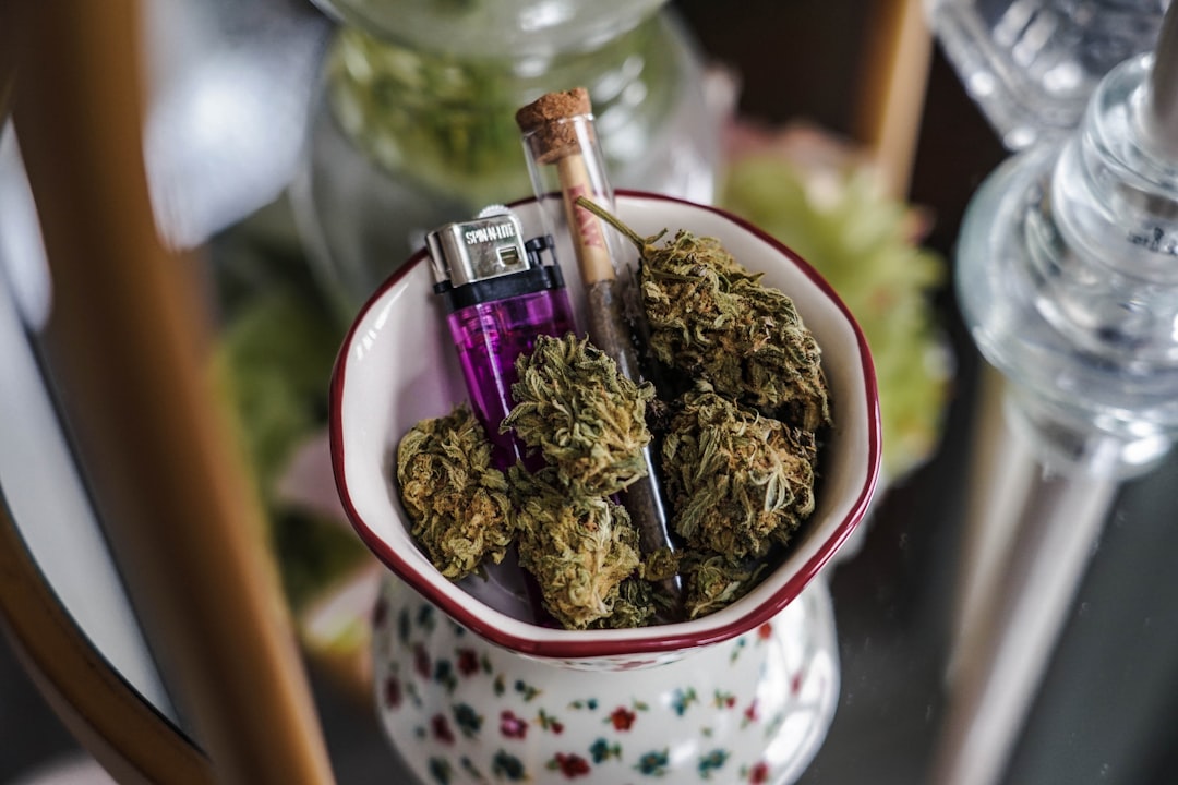tea cup with nugs lighter and a pipe