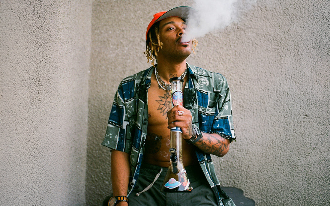 Smoker with bong and smoke exhalation