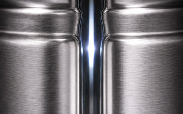 Close-up of two stainless steel barrels