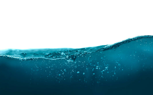 Water wave with bubbles on surface