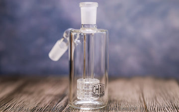Glass ash catcher from Chill Steel Pipes on wooden table