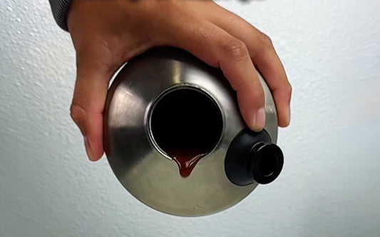 Pouring liquid from metal container
