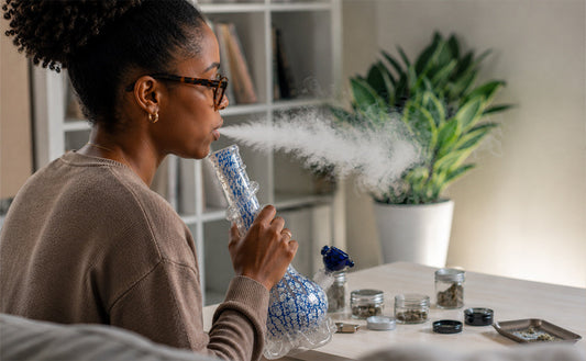 Black woman hitting soft glass bong