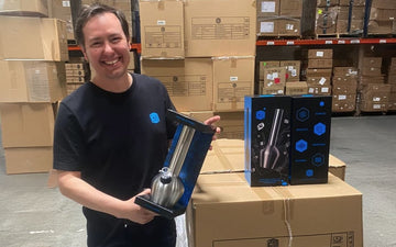 Man holding chill pipe in warehouse