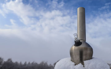 Metallic outdoor bong on snowy surface