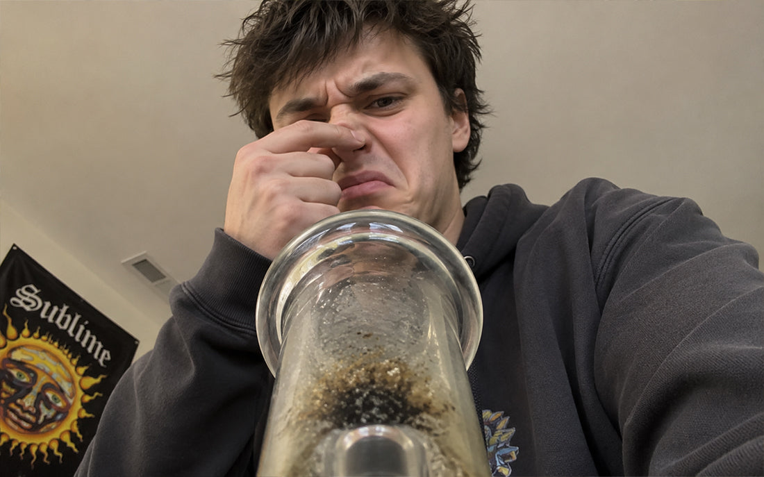 Person reacting to dirty bong odor